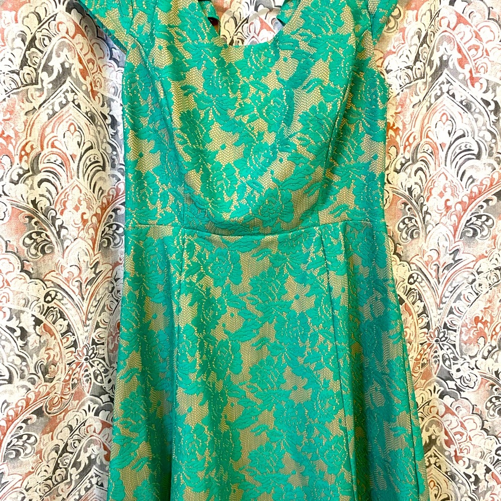 Teal colored dress with tan back print